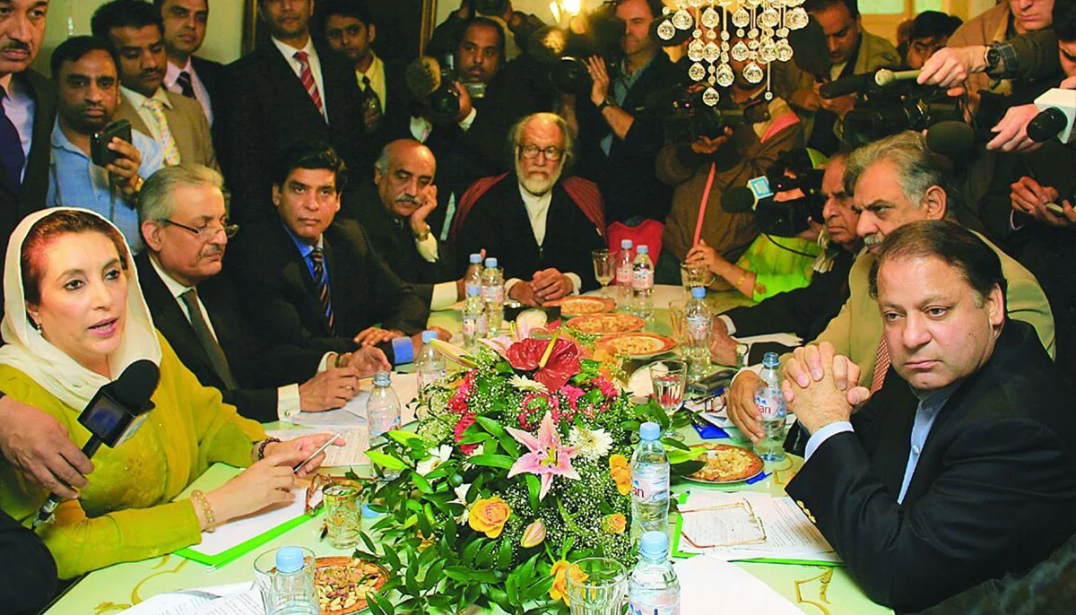 Late former PM Benazir Bhutto speaks during the signing ceremony of Charter of Democracy in London in 2006.—AFP