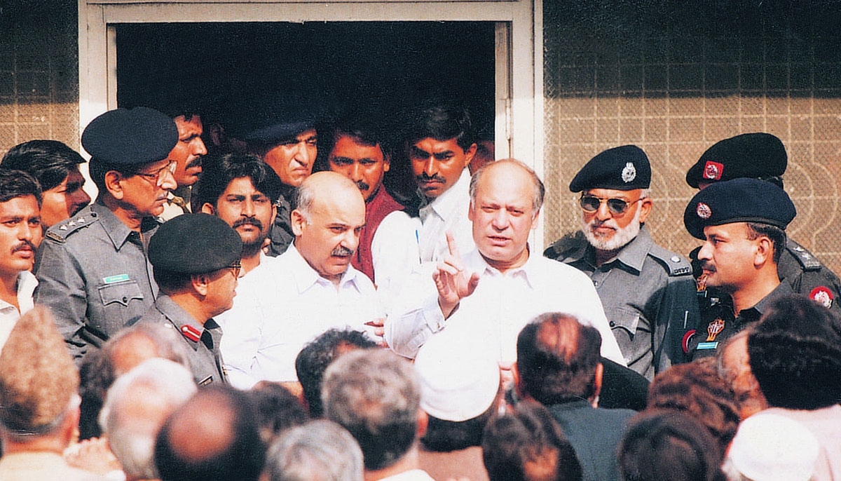 Deposed for the second time, Nawaz Sharif, with his brother Shahbaz Sharif, is seen at the entrance of Anti-terrorism Court No 1 in Karachi in December 1999.— Agencies