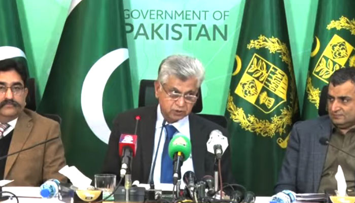 Caretaker Federal Minister for Information and Broadcasting Murtaza Solangi (centre) addresses a press conference on January 28, 2024, in this photo taken from a video. — PTV News