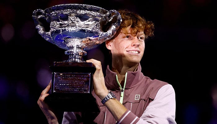 Italys Jannik Sinner celebrates with the trophy after winning the Australian Open final against Russias Daniil Medvedev at Melbourne Park, Australia, on January 28, 2024. — Reuters