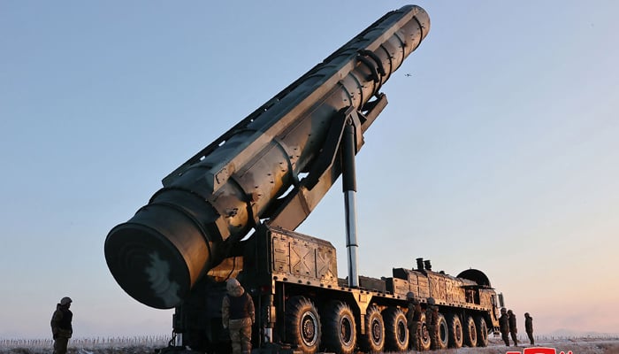 This picture on December 19, 2023 shows a mobile launcher awaiting the order to launch a Hwasongpho-18 intercontinental ballistic missile (ICBM) at an undisclosed location in North Korea. — AFP