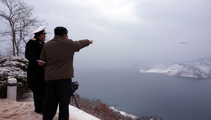 This photo taken on January 28, 2024 shows North Korean leader Kim Jong Un (right) inspecting a test-fire of the Pulhwasal-3-31 submarine-launched strategic cruise missile at an undisclosed location in North Korea. — AFP