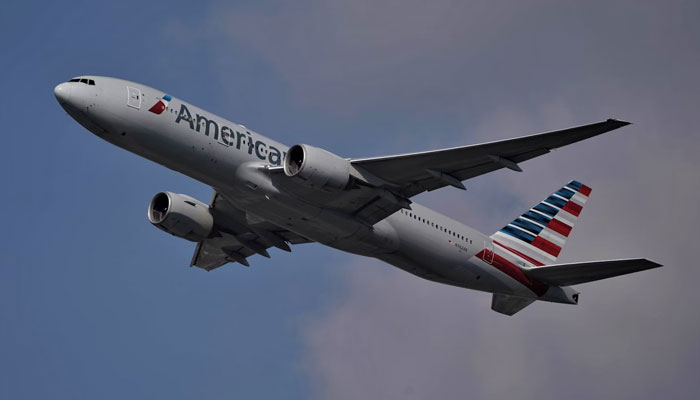 An American Airlines aircraft in the sky during a flight. — Unsplash