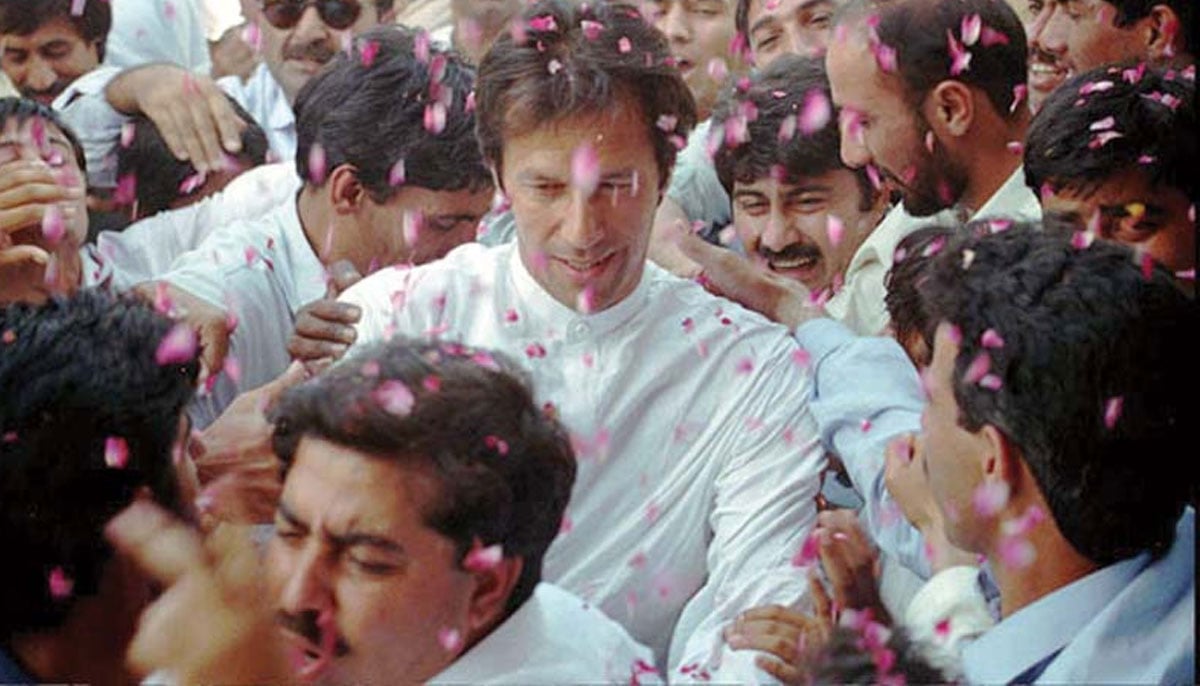 Imran Khan is showered with rose petals upon his arrival in this undated image. — PTI Karachi Media Cell