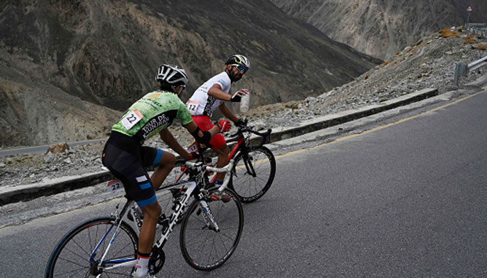 A representational image of two Pakistani cyclists Najeeb Ullah (right) and Hanzala during the Tour de Khunjerab, one of the worlds highest altitude cycling competitions, at the Pakistan-China Khunjerab border. — AFP/File