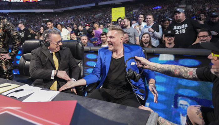 Pat McAfee (right) gets a high-five from Michael Cole as they announce their return to Monday Night Raw as its new commentary team at Amalie Arena in Tampa, Florida, US on January 29, 2024. — WWE