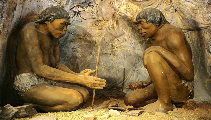 Figures of Stone Age hominins making tools at the National Museum of Mongolian History. — Wikimedia Commons
