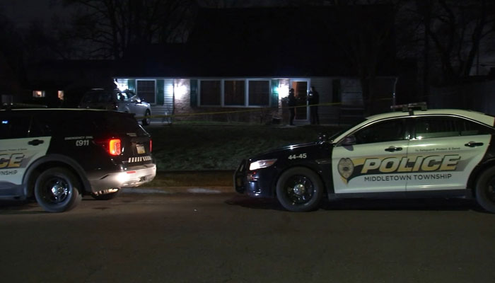 Police vehicles parked outside the home where Justin Mohns fathers decapitated body was found inMiddletown Township, Bucks County. — ABC News/File