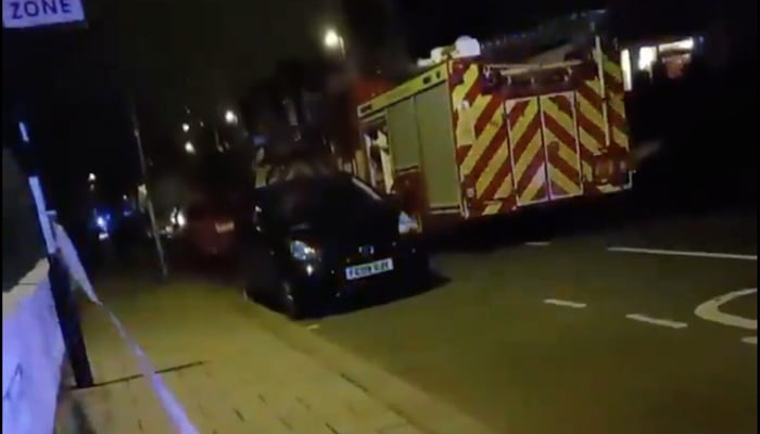 This still taken from a social media video from Clapham’s Lessar Avenue, area shows a fire brigade vehicle standing on the side of the road after the acid attack in London on January 31, 2024. — X/@CrimeLdn