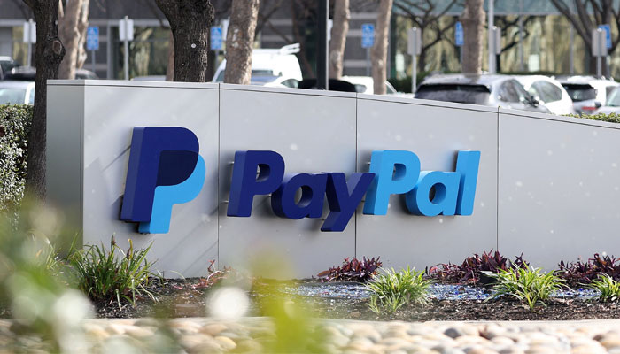 A PayPal sign is seen at its headquarters on January 30, 2024, in San Jose, California. — AFP