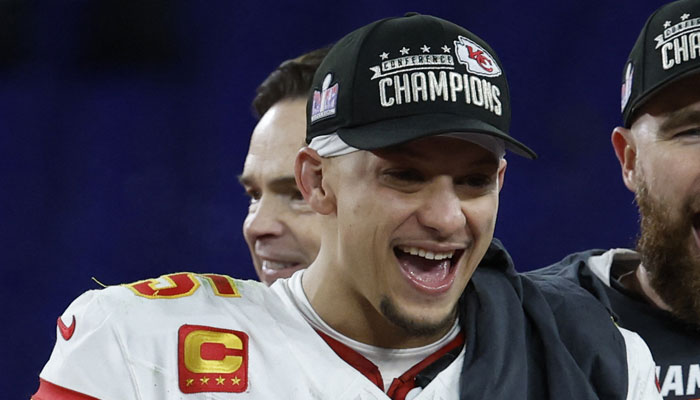 Kansas City Chiefs quarterback Patrick Mahomes celebrates on the stage before the trophy presentation on January 28, 2024. — Reuters