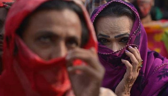 A transperson covers their face with a veil. — AFP/File