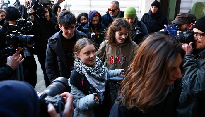 Swedish environmental activist Greta Thunberg (C) returns to Westminster Magistrates Court in London on February 1, 2024, on the first day of her and four other activists´ public order office trial. — AFP