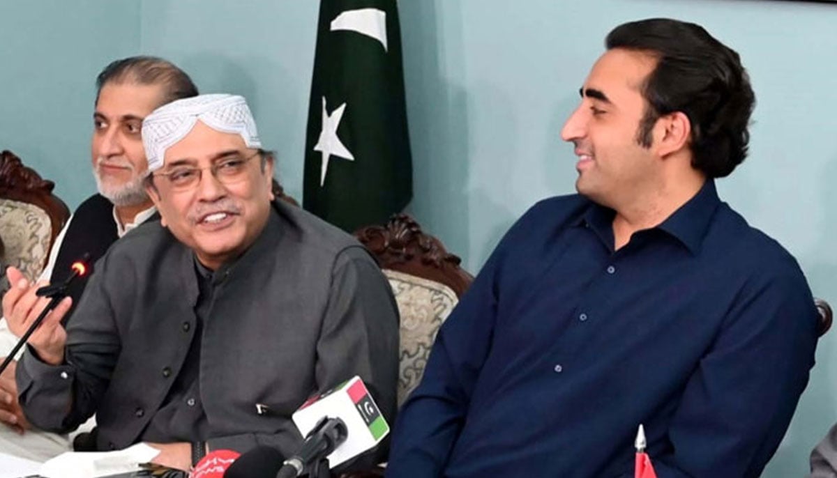 (Left to right) Peoples Party Co-Chairman, Asif Ali Zardari speaks as Chairman Bilawal Bhutto Zardari looks at him during a press conference, at Zardari House in Islamabad on Tuesday, March 29, 2022. — PPI