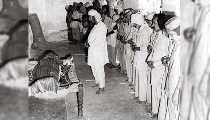 Last rites: In 1979, Bhutto was hanged through a sham trial by the Zia dictatorship. His body was secretly flown to his ancestral town (Larkana) in the middle of the night and quietly buried. The picture shows a handful of people saying funeral prayers over the body. Bhutto’s wife and children were not allowed to attend.—Agencies