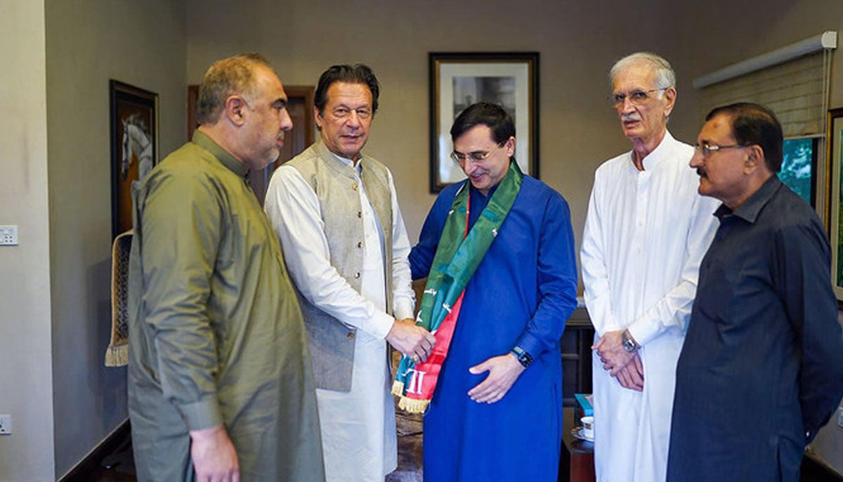 Former prime minister Imran Khan (second left) is pictured Barrister Gohar Khan (center) in Islamabad, Pakistan on October 22, 2022. — Barrister Gohar Khan/File