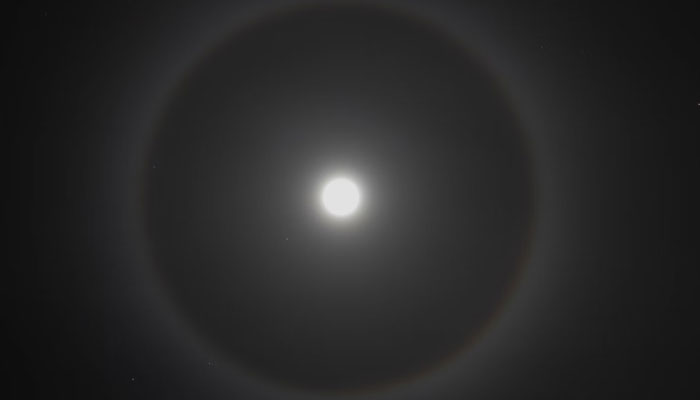 A halo around the moon. — Unsplash