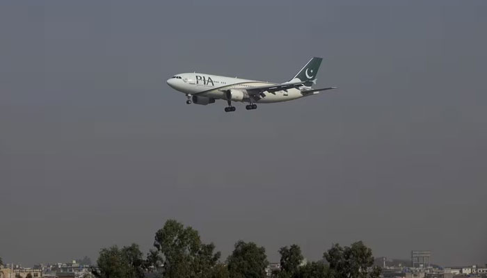 A Pakistan International Airlines (PIA) passenger plane arrives at the Benazir International airport in Islamabad, Pakistan, December 2, 2015. — Reuters