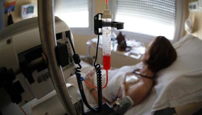 A patient receives chemotherapy treatment for breast cancer at the Antoine-Lacassagne Cancer Center in Nice, France, on July 26, 2012. —Reuters
