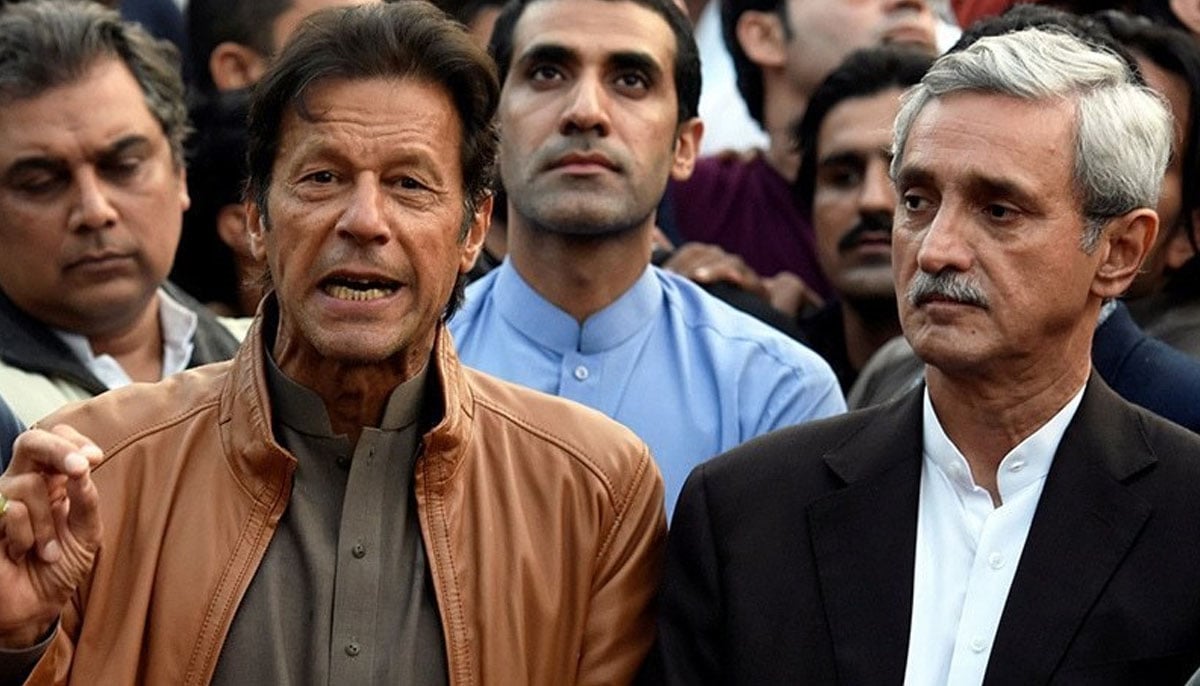 PTI founder Imran Khan speaks as Jahangir Tareen looks on during a press talk in this undated picture. —AFP