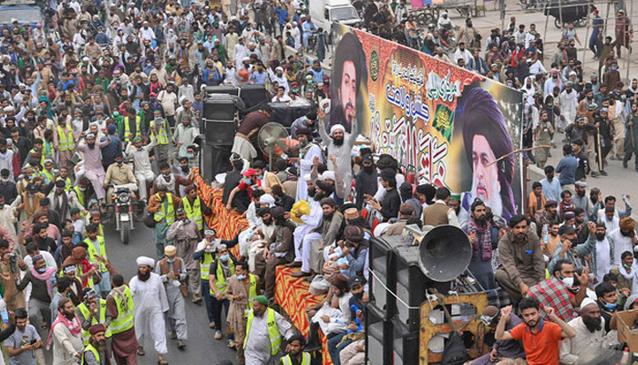 Supporters of TLP party take part in a protest march in Lahore, Pakistan, on October 23, 2021. — AFP