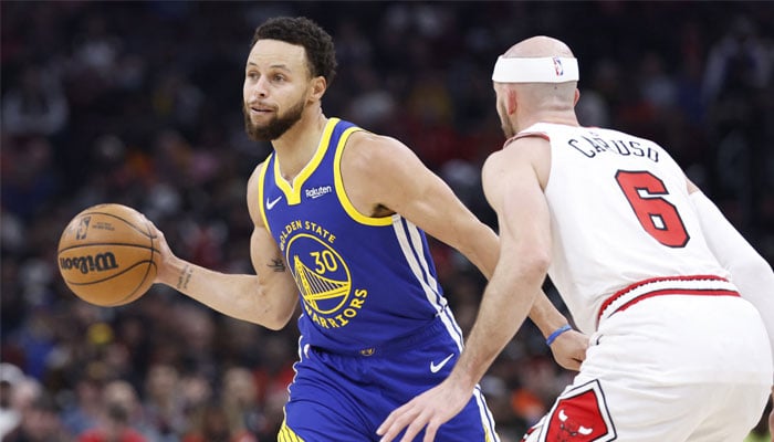 Golden State Warriors guard Stephen Curry (30) passes against Chicago Bulls guard Alex Caruso (6) during the first half at United Center in Chicago, Illinois, US on January 12, 2024. — Reuters