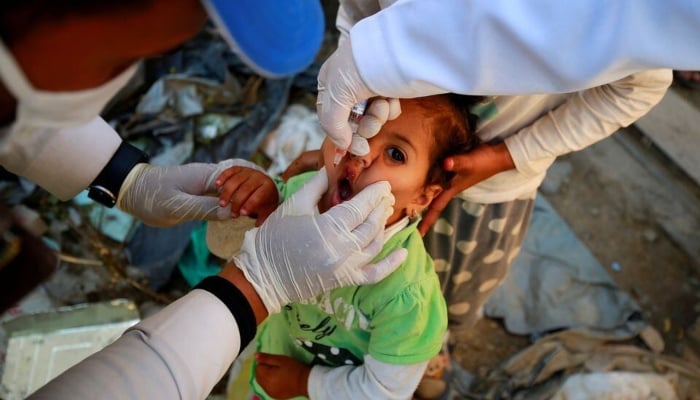 A girl receives a polio vaccine during a three-day immunisation campaign on November 29, 2020. —Reuters