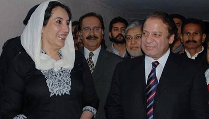 Benazir Bhutto (left) receiving her political rival Nawaz Sharif (right) at her residence in Islamabad on December 3, 2007. — Reuters