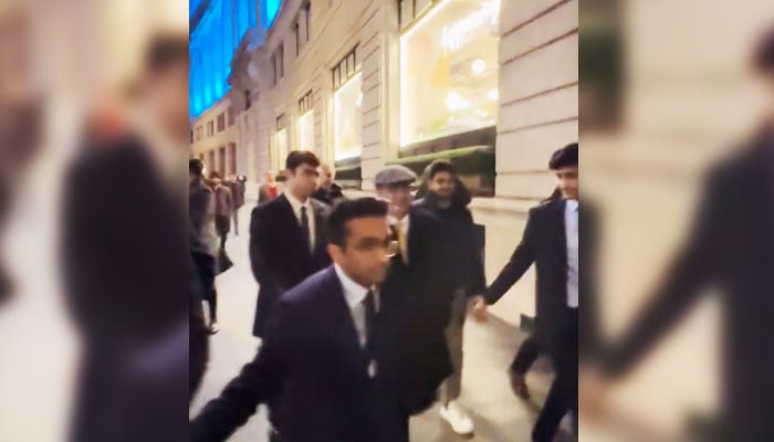 Pakistan Tehreek-e-Insaf supporters heckle Supreme Court (SC) Justice Athar Minallah at the London School of Economics in this still taken from a video. — X/MurtazaViews
