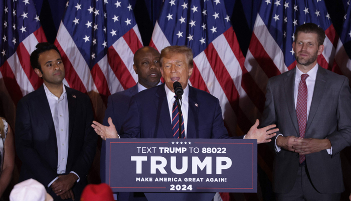 Former US President Donald Trump delivers remarks alongside supporters, campaign staff and family members during his primary night rally at the Sheraton on January 23, 2024, in New Hampshire. — AFP