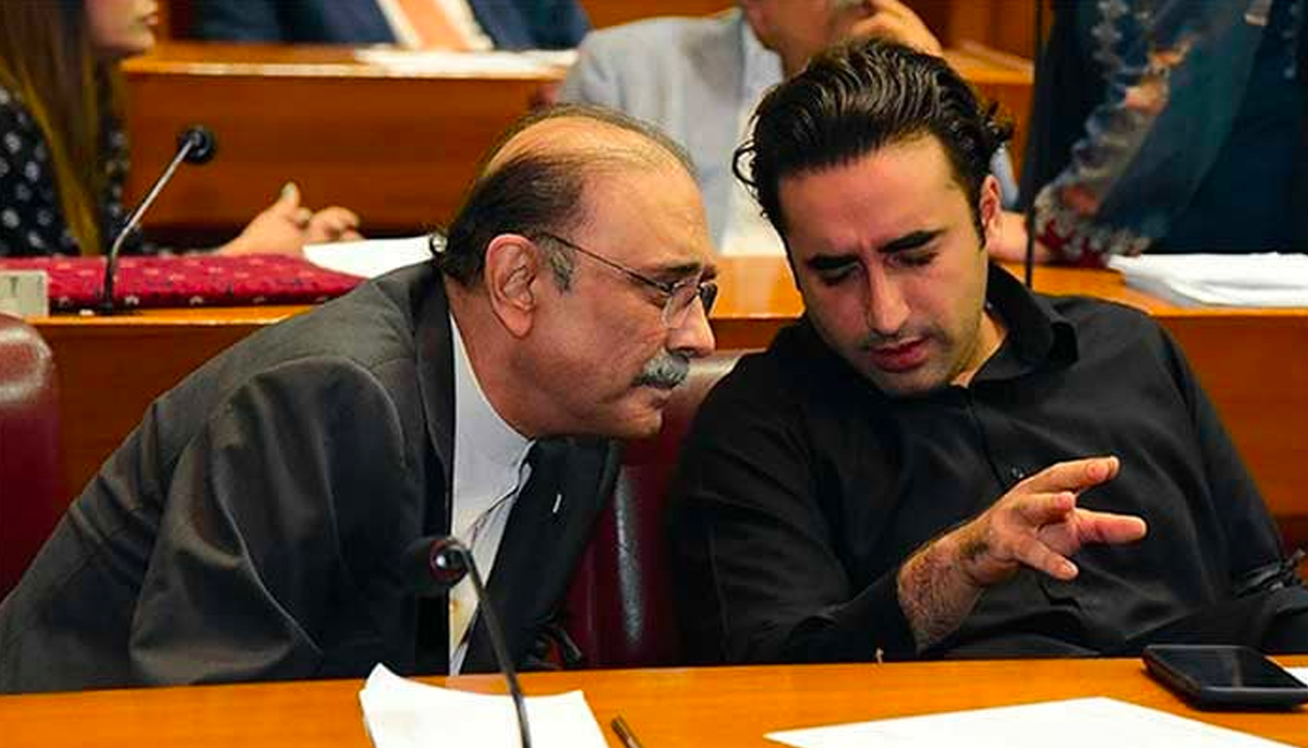 Former president Asif Zardari and PPP Chairman Bilawal Bhutto having a discussion during a National Assembly session. — APP/File