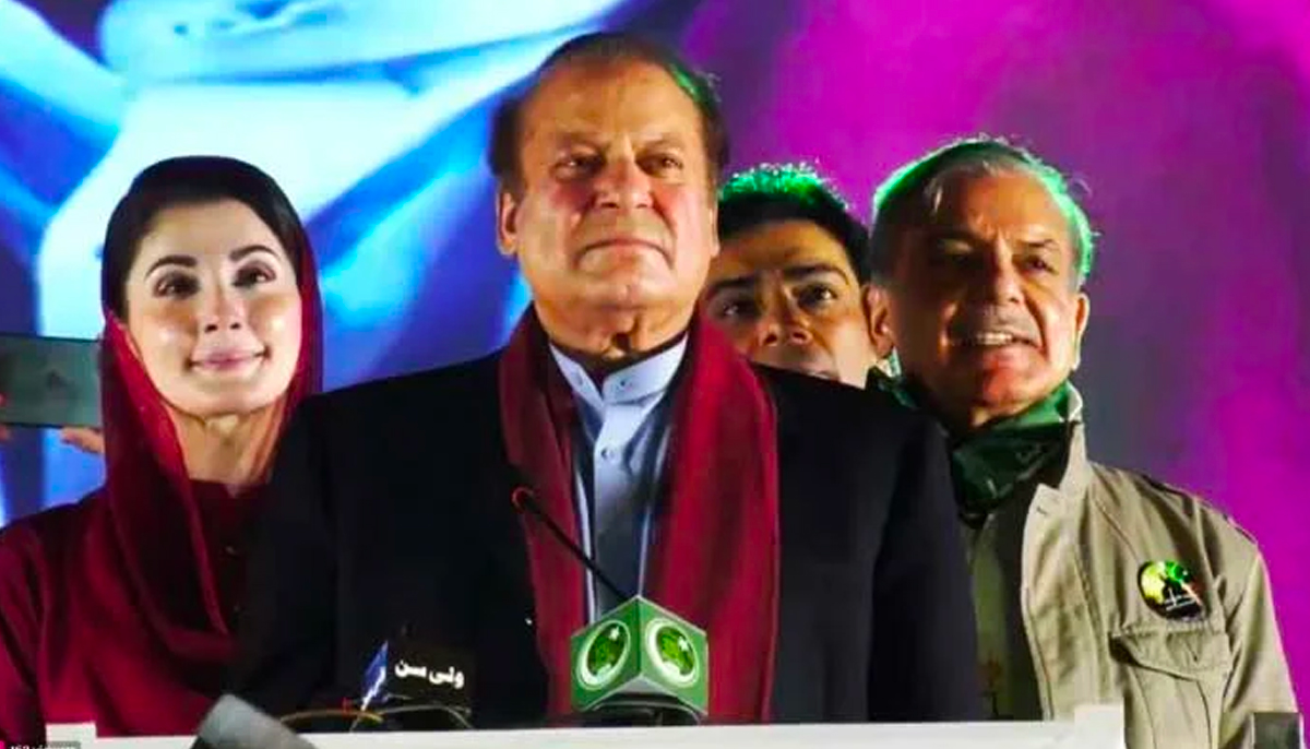 PML-N leaders Maryam Nawaz, Nawaz Sharif, and Shehbaz Sharif at the stage during a rally at Minar-e-Pakistan in Lahore, on October 21, 2023, in this still taken from a video. — Xpmln_org