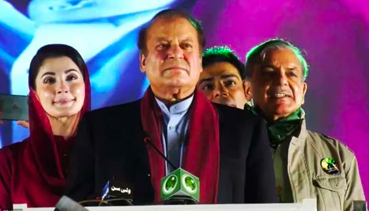 PML-N leaders Maryam Nawaz, Nawaz Sharif, and Shehbaz Sharif at the stage during a rally at Minar-e-Pakistan in Lahore, on October 21, 2023, in this still taken from a video. — X@pmln_org