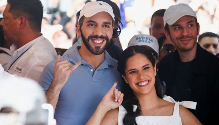 El Salvadors President Nayib Bukele, who is running for reelection, and his wife Gabriela de Bukele, show their inked fingers during the presidential and parliamentary elections in San Salvador, El Salvador, February 4, 2024. — Reuters