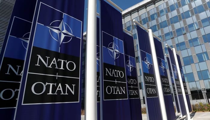 Banners displaying the Nato logo are placed at the entrance of the new Nato HQs during the move to the new building, in Brussels, Belgium. — Reuters/File