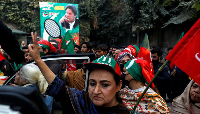 Women supporters of former Prime Minister Imran Khan hold flags during a rally ahead of the general elections in Lahore, Pakistan January 28, 2024. — Reuters
