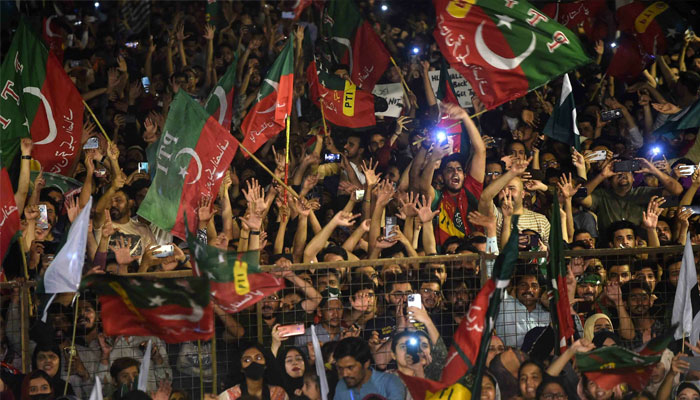 PTI supporters take part in a rally in support of former Prime Minister Imran Khan in Karachi on April 10, 2022. — Reuters