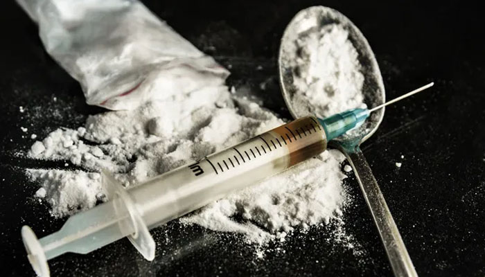 Liquid heroin kept on a table. — FotoMaximum/File