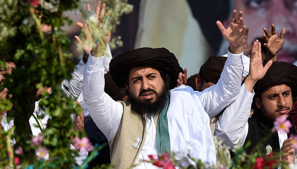 TLP chief Saad Rizvi waves to supporters at a commemoration ceremony held to mark his father Khadim Hussain Rizvis death anniversary in Lahore. —AFP