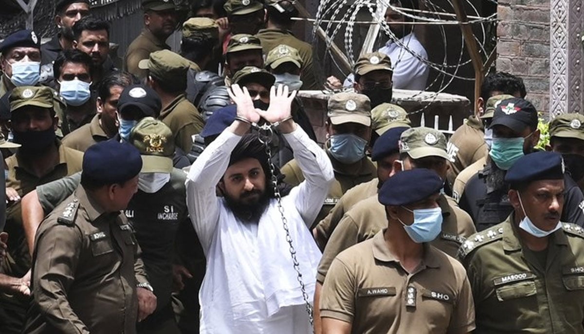 Hafiz Saad Hussain Rizvi (C), son of late Khadim Hussain Rizvi, the founder of TLP, waves as he arrives outside court in Lahore on July 2, 2021.—AFP