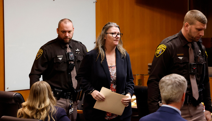 Jennifer Crumbley, the mother of accused Oxford High School gunman Ethan Crumbley exits the courtroom of Oakland County Court in Pontiac, Michigan during a break in her trial on four counts of involuntary manslaughter on February 2, 2024. — AFP