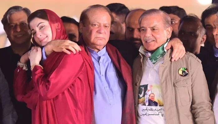 (Left to right) PML-N leaders Maryam Nawaz, Nawaz Sharif and Shehbaz Sharif at the stage during a rally at Minar-e-Pakistan in Lahore, on October 21, 2023, in this still taken from a video. — X@pmln_org