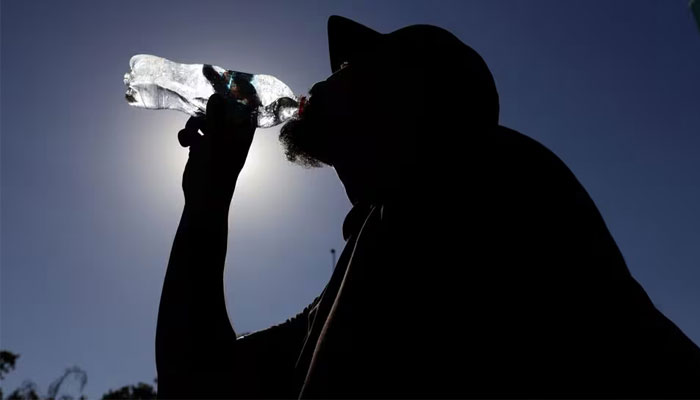 A man drinks water during a heat wave, in Santiago, Chile January 31, 2024. — Reuters