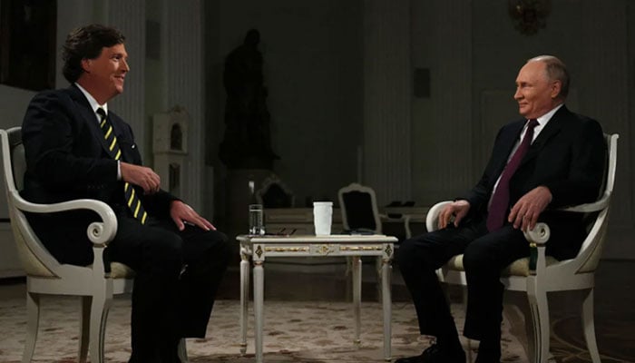 Host Tucker Carlson (left) and Russian President Vladimir Putin. — AFP/File