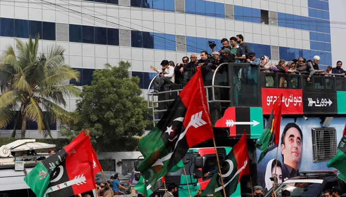 Supporters of Bilawal Bhutto Zardari, Chairman of the PPP, gather around his vehicle during an election campaign rally, ahead of the general elections, in Karachi, on February 5, 2024. — Reuters