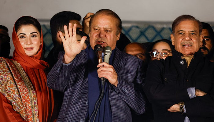 Former prime minister Nawaz Sharif (centre), flanked by his daughter Maryam Nawaz Sharif (left) PML-N President Shehbaz Sharif, addresses party workers at Model Town in Lahore, Pakistan, on February 9, 2024. — Reuters