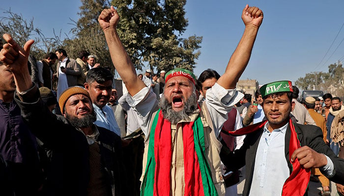 Supporters of former Prime Minister Imran Khans party, the Pakistan Tehreek-e-Insaf (PTI), shout slogans during a protest outside a temporary election commission office demanding free and fair results of the election, in Peshawar, Pakistan, February 9, 2024. — Reuters