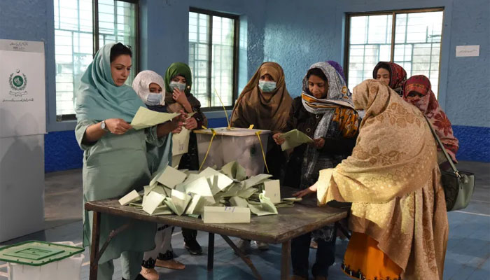 The picture shows presiding officers counting votes. — AFP/File