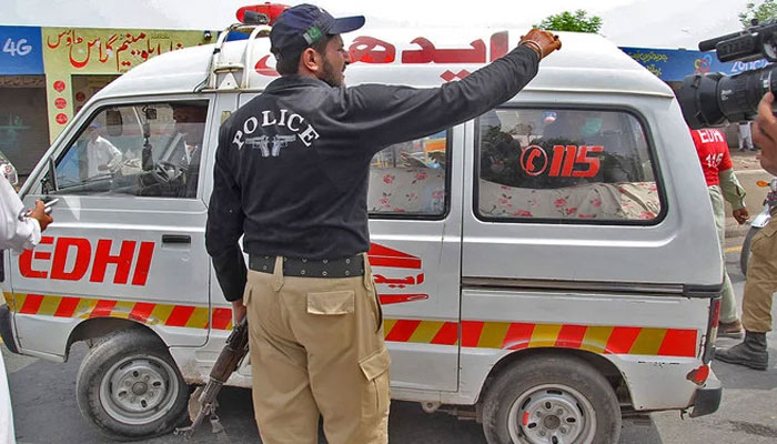 This undated image shows an Edhi ambulance with police personnel making a way. — AFP/File