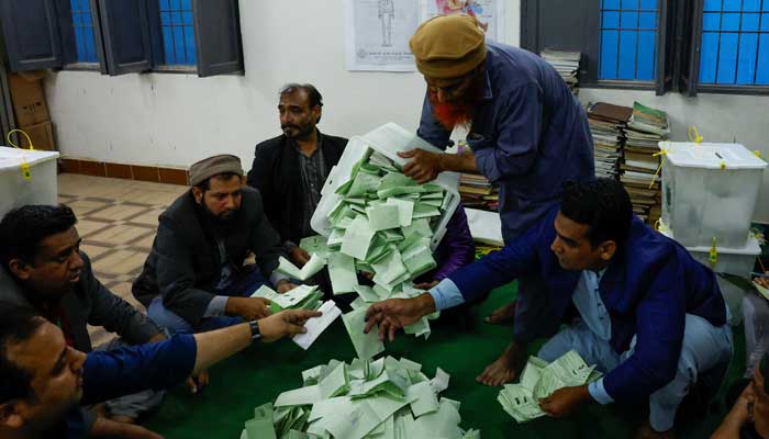 Polling officers count ballot papers during the general election in Karachi, Pakistan February 8, 2024. —Reuters